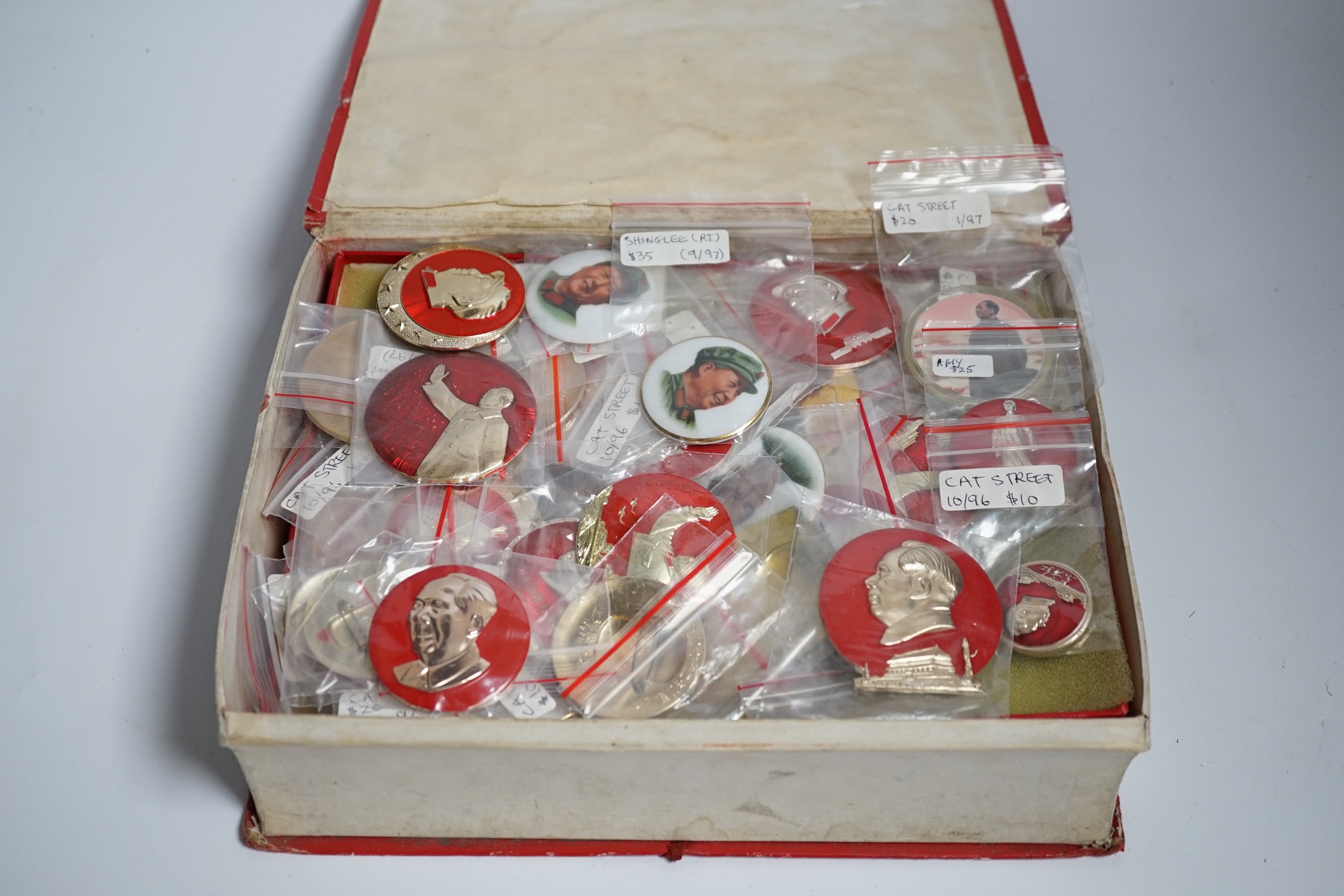 A collection of forty one Chinese Mao Zedong badges and a box